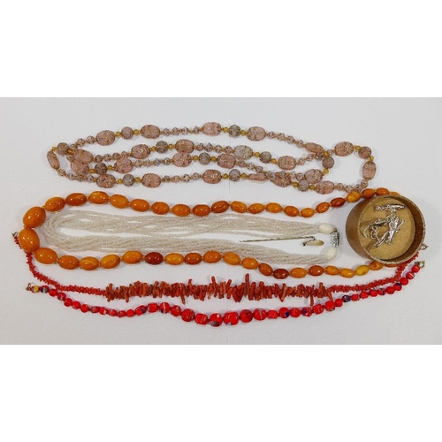 38 - A string of butterscotch amber beads, 69.5cm, the largest bead 1.4cm x 1.9cm, 36.4g gross, a coral b... 