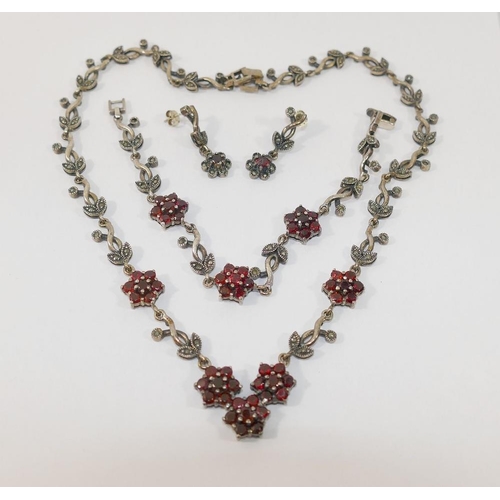 61 - A suite of garnet and marcasite silver coloured metal jewellery, comprised of a necklace, bracelet a... 