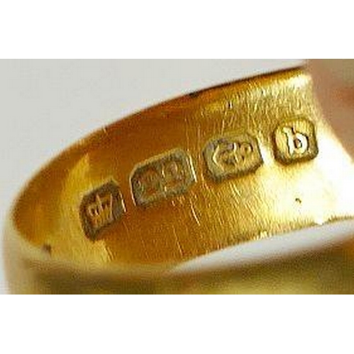 63 - A large 22 carat gold wedding band, London 1971, finger size V 1/2, and another smaller 22 carat gol... 