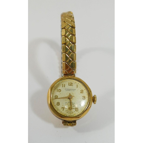 69 - A 9 carat gold Dennison cased Winegartens ladies 17 jewel bracelet watch, Birmingham 1957, with Arab... 