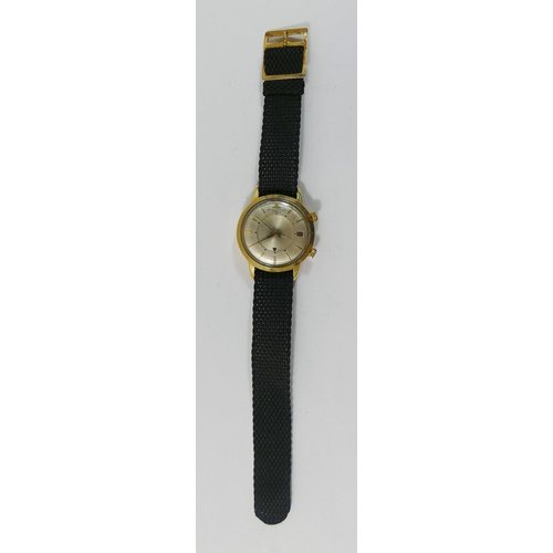 77 - A mid 20th century gold cased Jaeger-le-Coultre Memovox gentleman's automatic wristwatch, the outer ... 