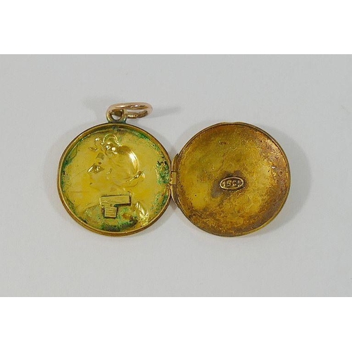 9A - An Art Nouveau circular gold locket, the interior stamped '15Ct', the front embossed with the head a... 