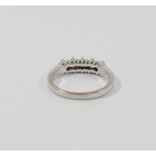 9 - An 18 carat white gold diamond five stone ring, the round brilliant cut stones each approximately 0.... 