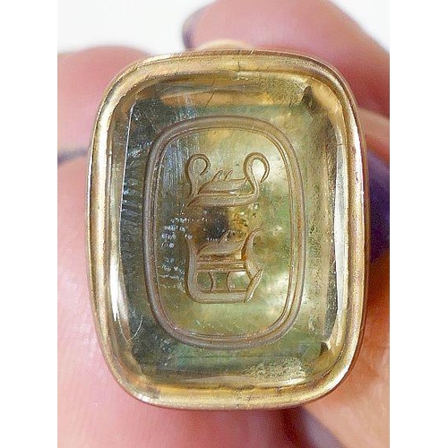 97 - A Georgian gold seal, set with bloodstone intaglio carved with Soltaire cross with Griffin surmount,... 