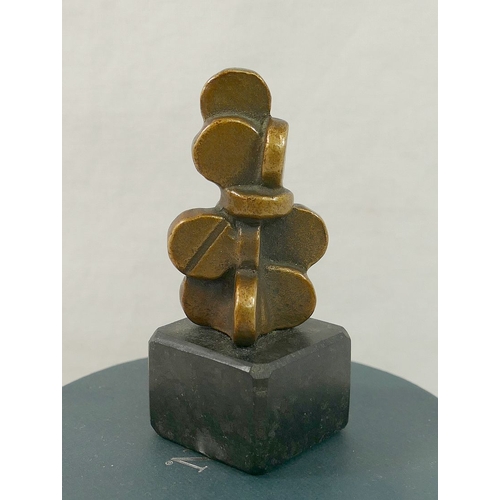 165 - A small abstract bronze of stacked disks, initialled 'LH', on stone plinth, 8.5cm high