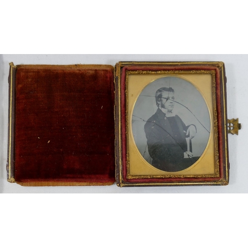 319A - Five 19th century ambrotypes featuring women and each housed within gilt metal mount and velvet surr... 