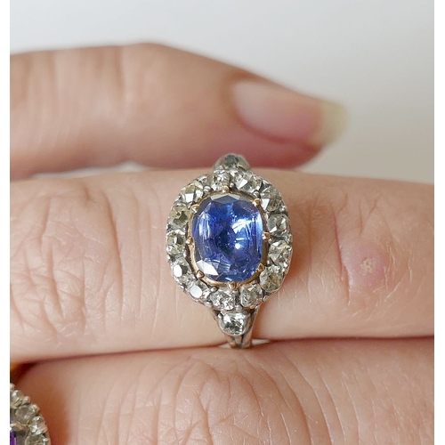 3A - A Georgian sapphire and diamond oval cluster ring, housed ornately in engraved closed back setting, ... 