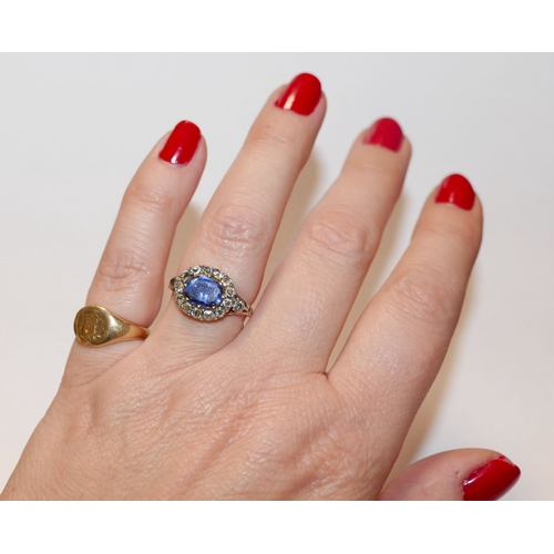 3A - A Georgian sapphire and diamond oval cluster ring, housed ornately in engraved closed back setting, ... 