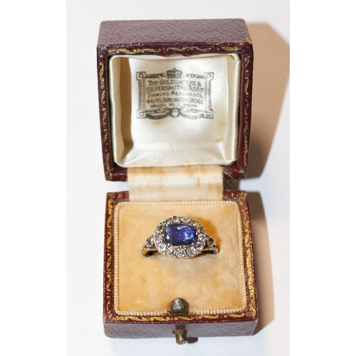 3A - A Georgian sapphire and diamond oval cluster ring, housed ornately in engraved closed back setting, ... 