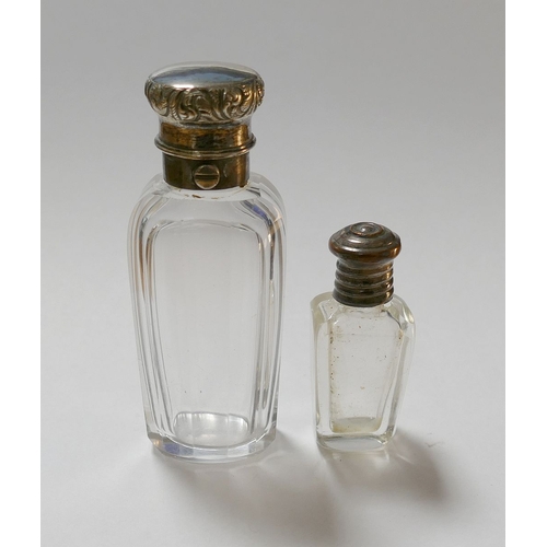 89A - A collection of eight 19th century scent bottles, comprised of a silver topped panelled glass exampl... 