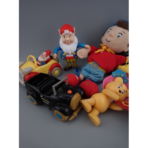 148 - A collection of vintage Noddy characters and vehicles, including plush toys and plastic figures. The... 