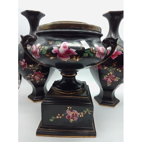 23 - This is a set of black porcelain vases and a twin-handled planter featuring hand-painted floral desi... 
