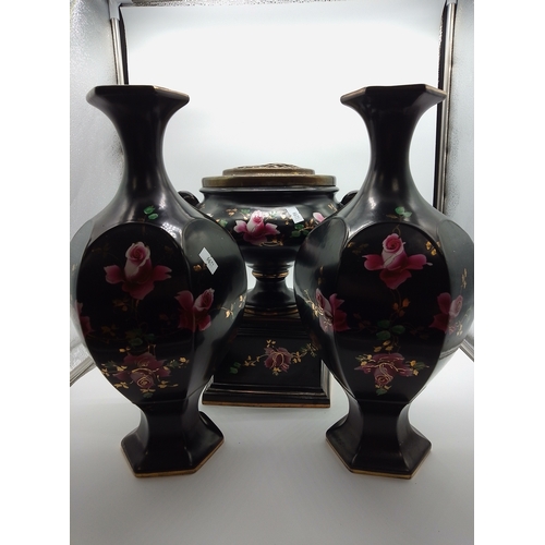 23 - This is a set of black porcelain vases and a twin-handled planter featuring hand-painted floral desi... 
