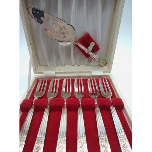 1 - This is a vintage silver-plated dessert set featuring six forks and a coordinating serving piece nes... 