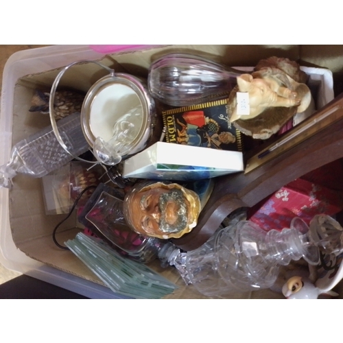 41 - This box contains a variety of assorted items, including pottery, clocks, and other collectible good... 