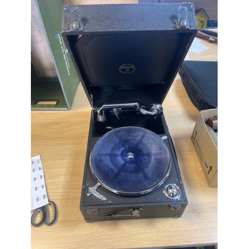 A vintage HMV portable gramophone in its open carrying case, including ...