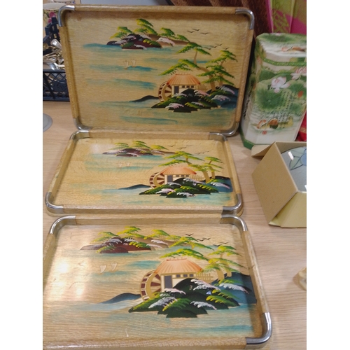 A collection of Oriental themed items including a jar with tea, fan, a ...