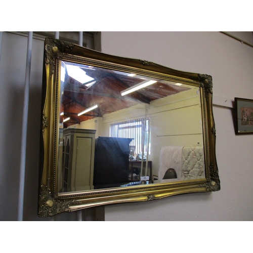 180 - A rectangular gilt framed bevelled wall mirror