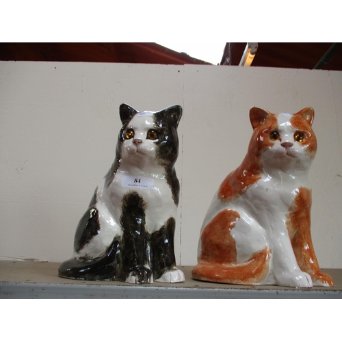 84 - Two large porcelain cats