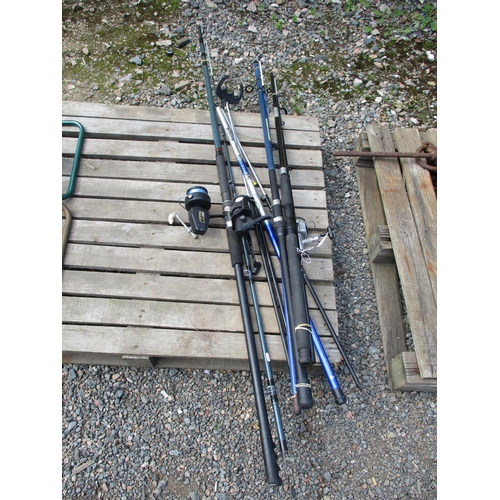 100 - Three assorted fishing rods and reels, a tripod and a fresh water pole