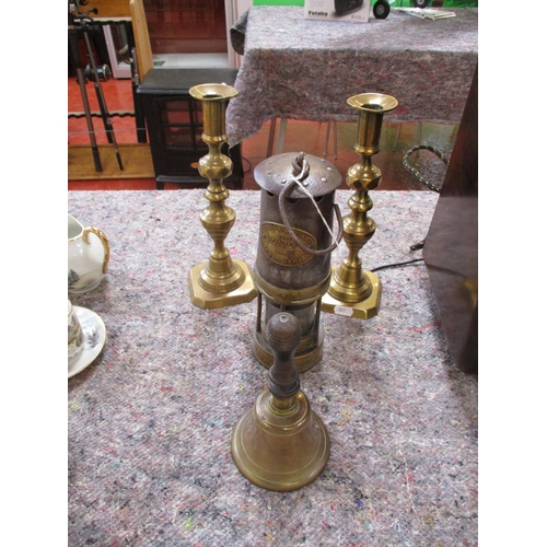 361 - An original miner's safety lantern by Thomas & Williams, a pair of brass candle sticks and a bronze ... 