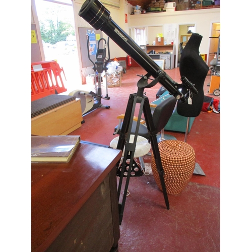 366 - A Tasco astrological telescope and tripod