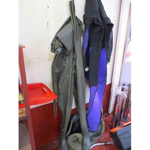 448 - A pair of waders, a keep net, a wetsuit etc.