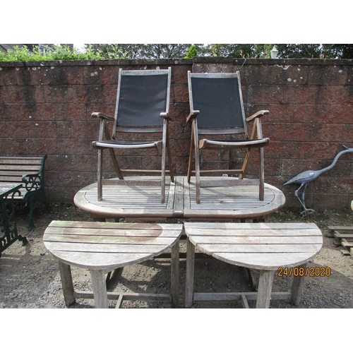 110 - A teak extending garden table together with two half round teak tables and a pair of folding teak ch... 