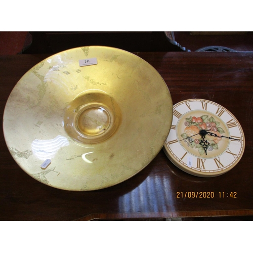 241 - A large gilded glass fruit bowl together with a Jersey Pottery wall clock