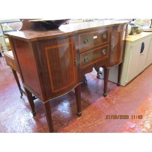 242 - A cross banded mahogany sideboard modelled in the Regency style