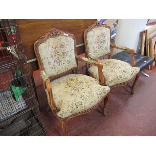 321 - A pair of open armchairs in the French style