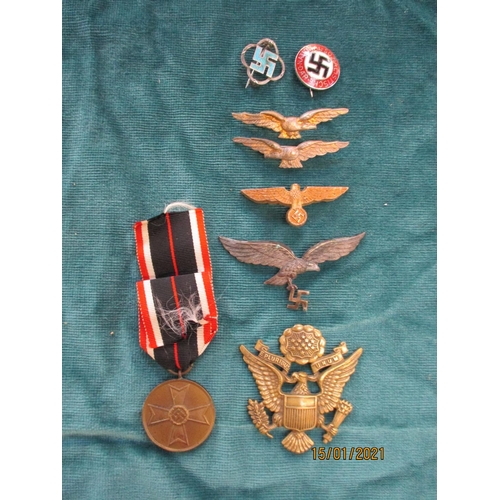 133 - Various medals, uniform and tunic badges etc.