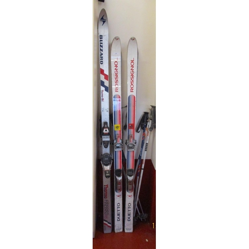 134 - Three pairs of vintage snow skis and poles