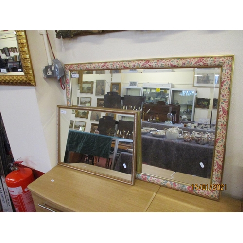 135 - A gilt framed bevelled rectangular dressing mirror, a rectangular wall mirror with florally decorate... 