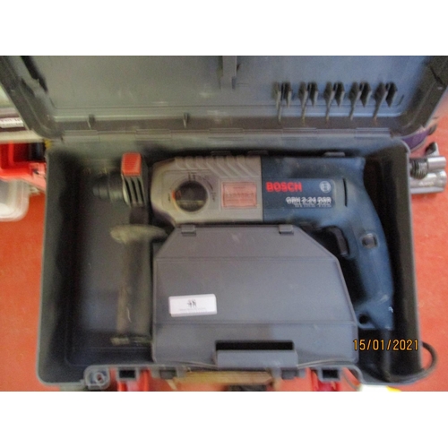 48 - A Bosch GBB 2-24DSR 110 volt rotary drill together with a Bosch GST97 jigsaw