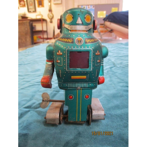 71 - Three mid twentieth century tinplate clockwork models, two of robots the other of a toucan