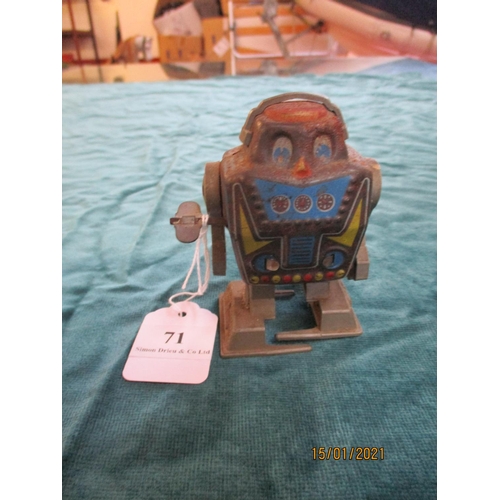 71 - Three mid twentieth century tinplate clockwork models, two of robots the other of a toucan