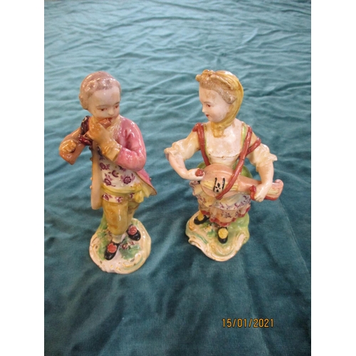 75 - A pair of Derby child musicians together with a pair of Derby figures of a child Sultan and Sultana