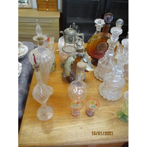 163 - A vintage soda syphon together with a varied accumulation of glass and novelty decanters