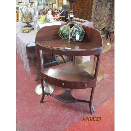 181 - A Georgian mahogany corner wash stand the under tier fitted a centre drawer and two false drawers