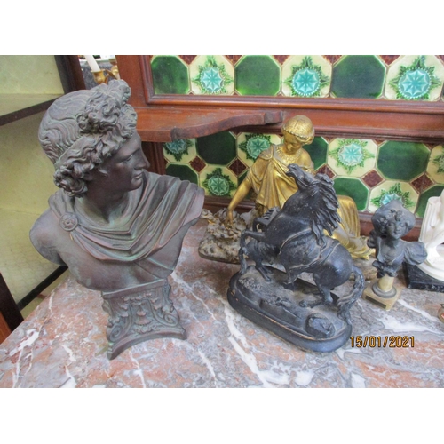 221 - A bronzed bust of a neo classical gentleman, various figurines of women, a model of a rearing horse ... 