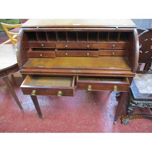 232 - A George III mahogany cylinder top bureau with tambour rising top opening to reveal a fitted interio... 