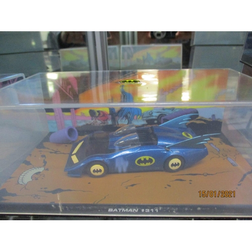 305 - A collection of thirty three DC comics, Batman Series vehicles, three figures and a holographic pict... 