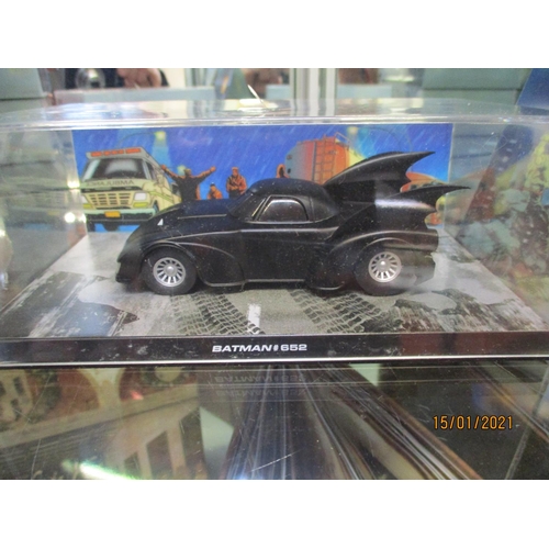 305 - A collection of thirty three DC comics, Batman Series vehicles, three figures and a holographic pict... 