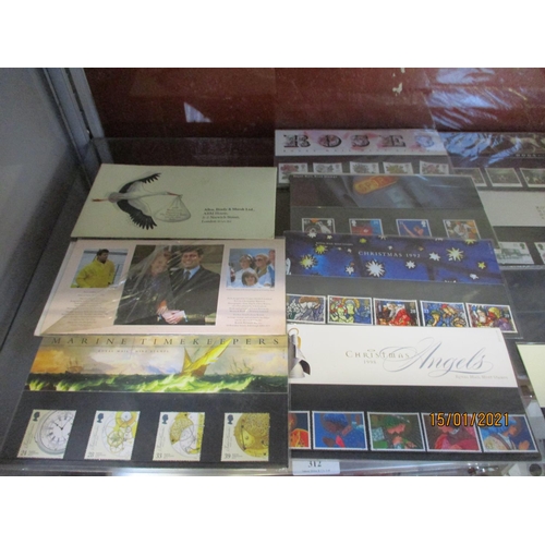 311 - A collection of first day covers together with an album of vintage postage stamps