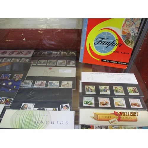 311 - A collection of first day covers together with an album of vintage postage stamps