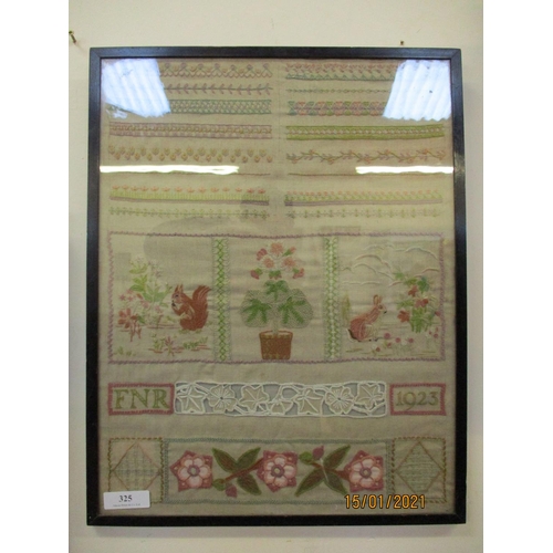 325 - A framed needlework sampler monogrammed FNR and dated 1923, 51.5cm x 40cm