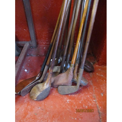 355 - A collection of vintage golf clubs