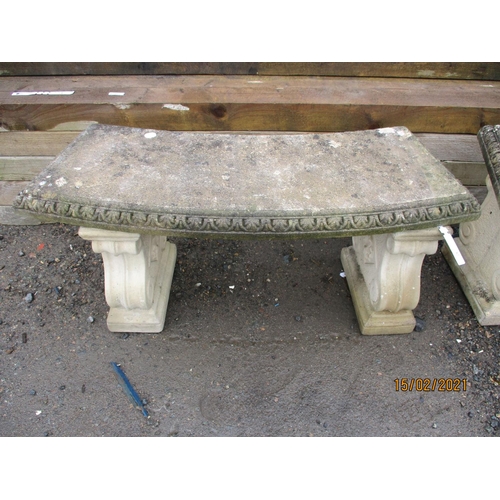 62 - A pair of reconstituted stone slightly shaped garden benches