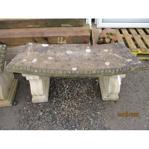 62 - A pair of reconstituted stone slightly shaped garden benches